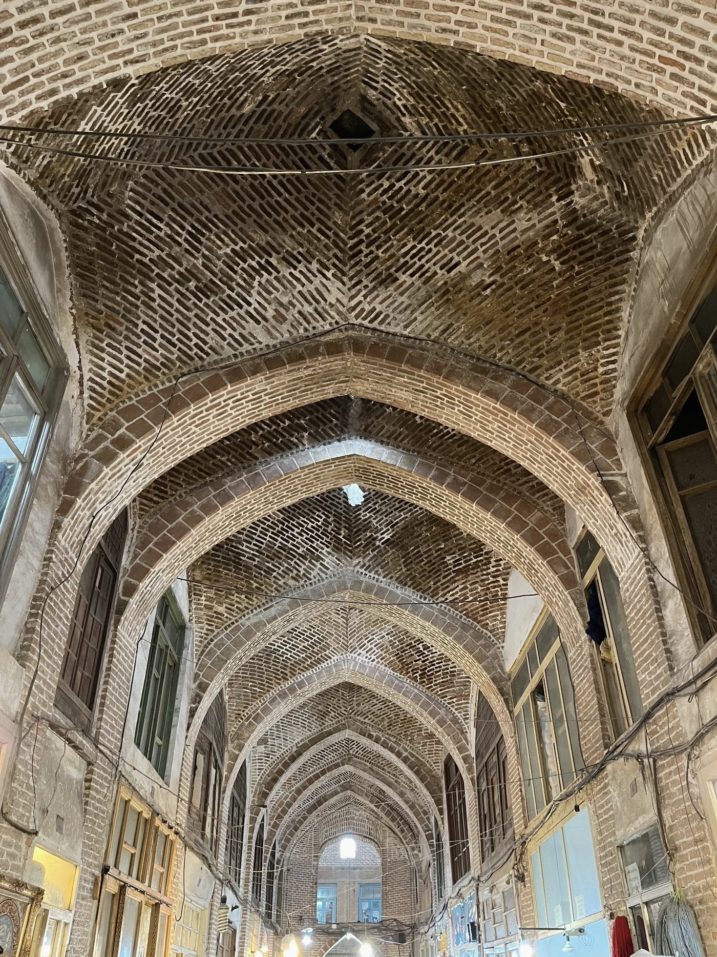 Rhythmic vaults and depth within a covered passage